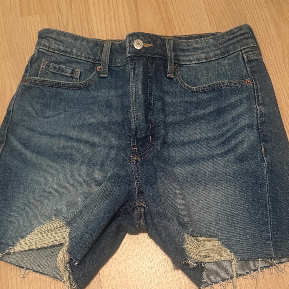 Distressed High-Rise Denim Shorts in Medium Blue